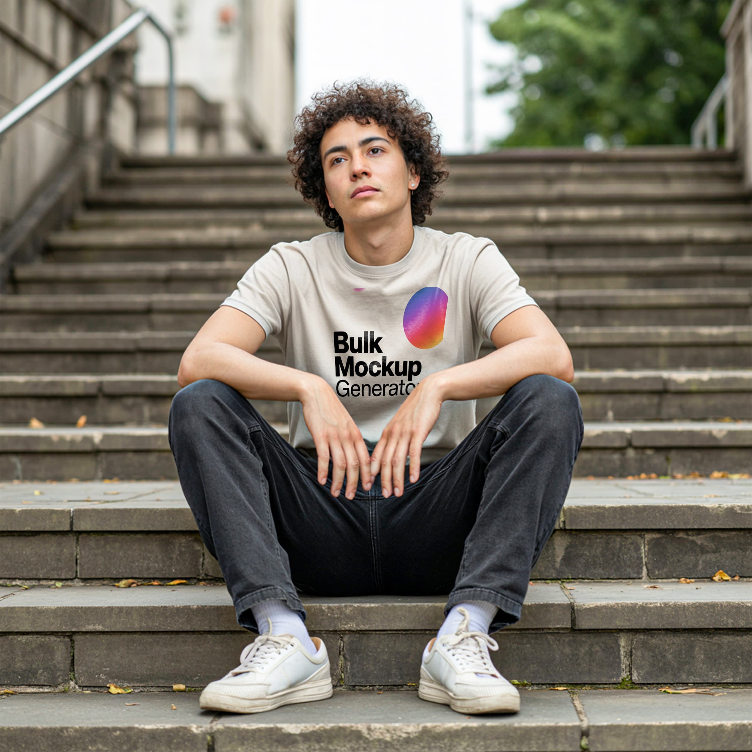 Man Sitting on Steps in Beige T-Shirt